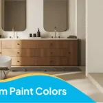 Bathroom paint colors in a modern neutral bathroom with beige walls, a wooden vanity, and rounded mirrors.