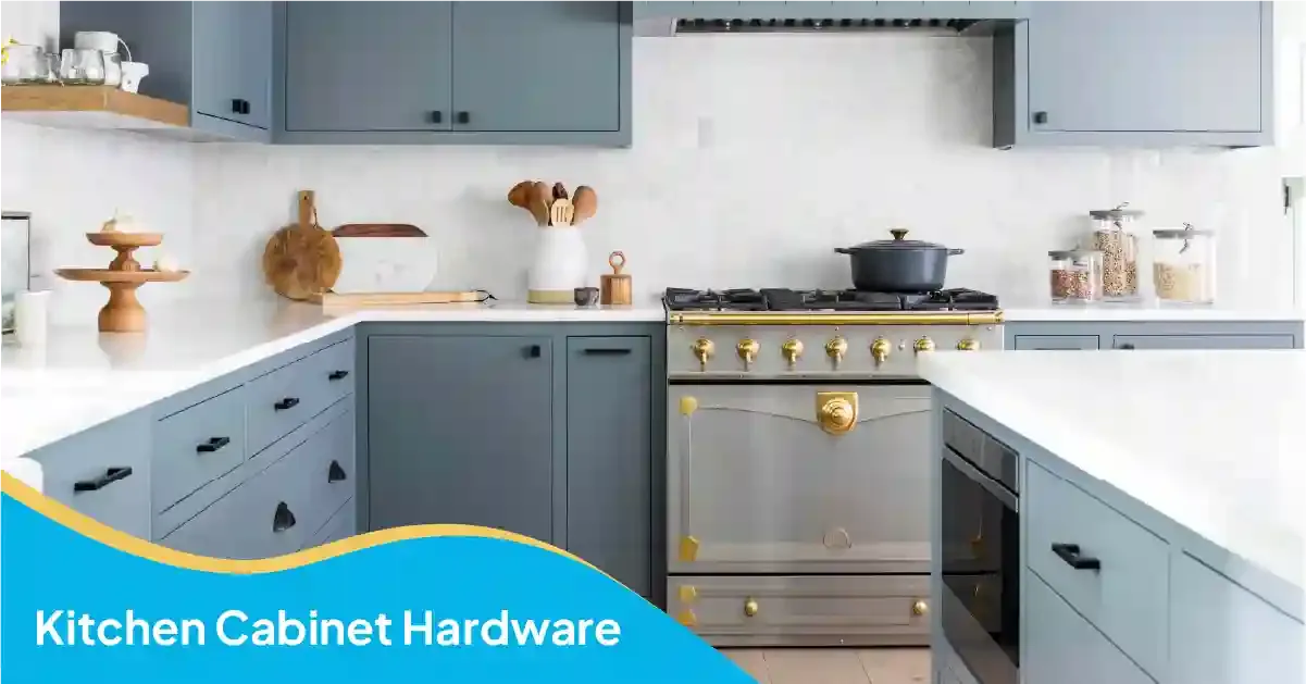 Kitchen cabinet hardware featuring black drawer pulls, brass oven knobs, and blue-gray cabinets in a modern kitchen.